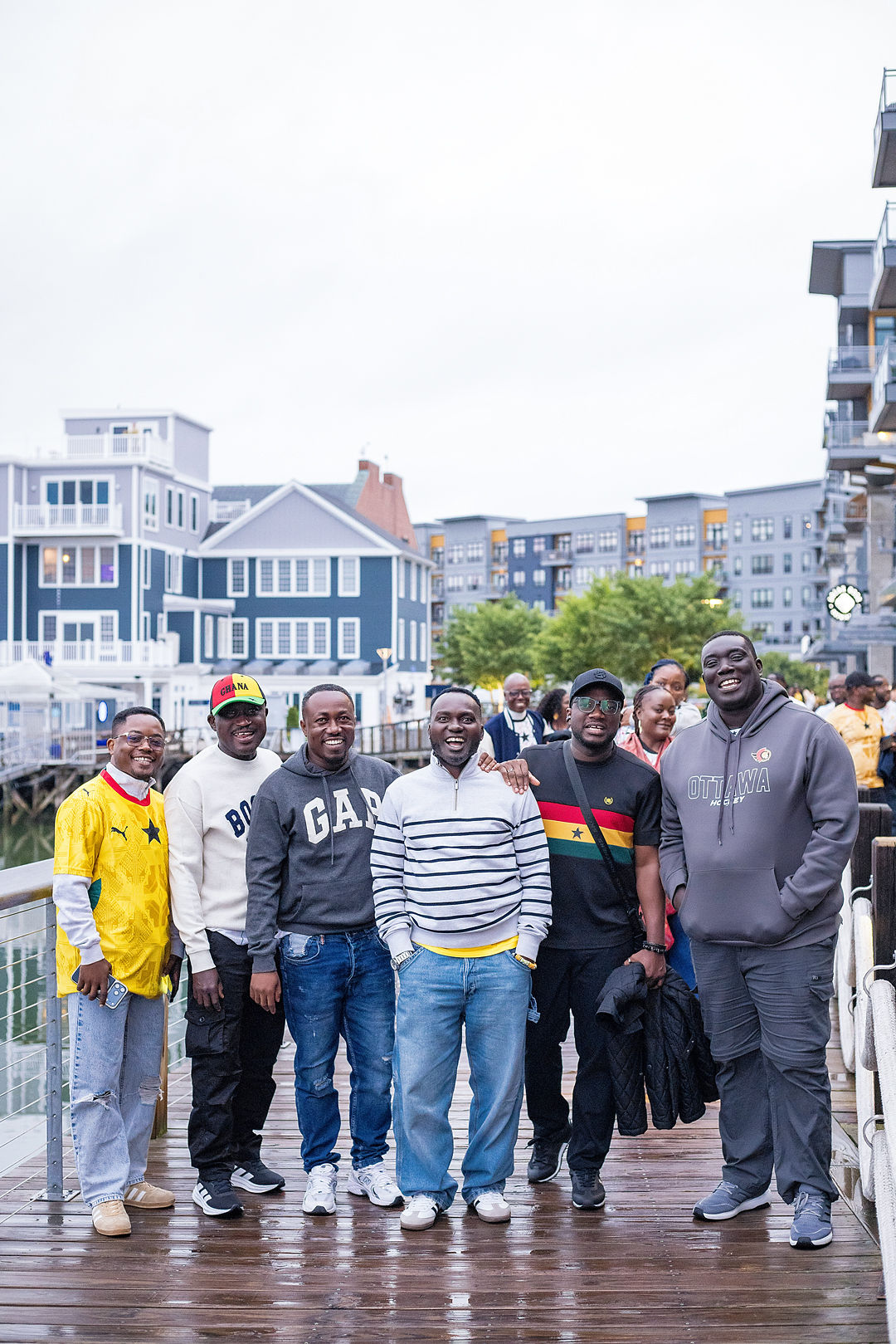 Group of Ghana fans on a harbour boardwalk