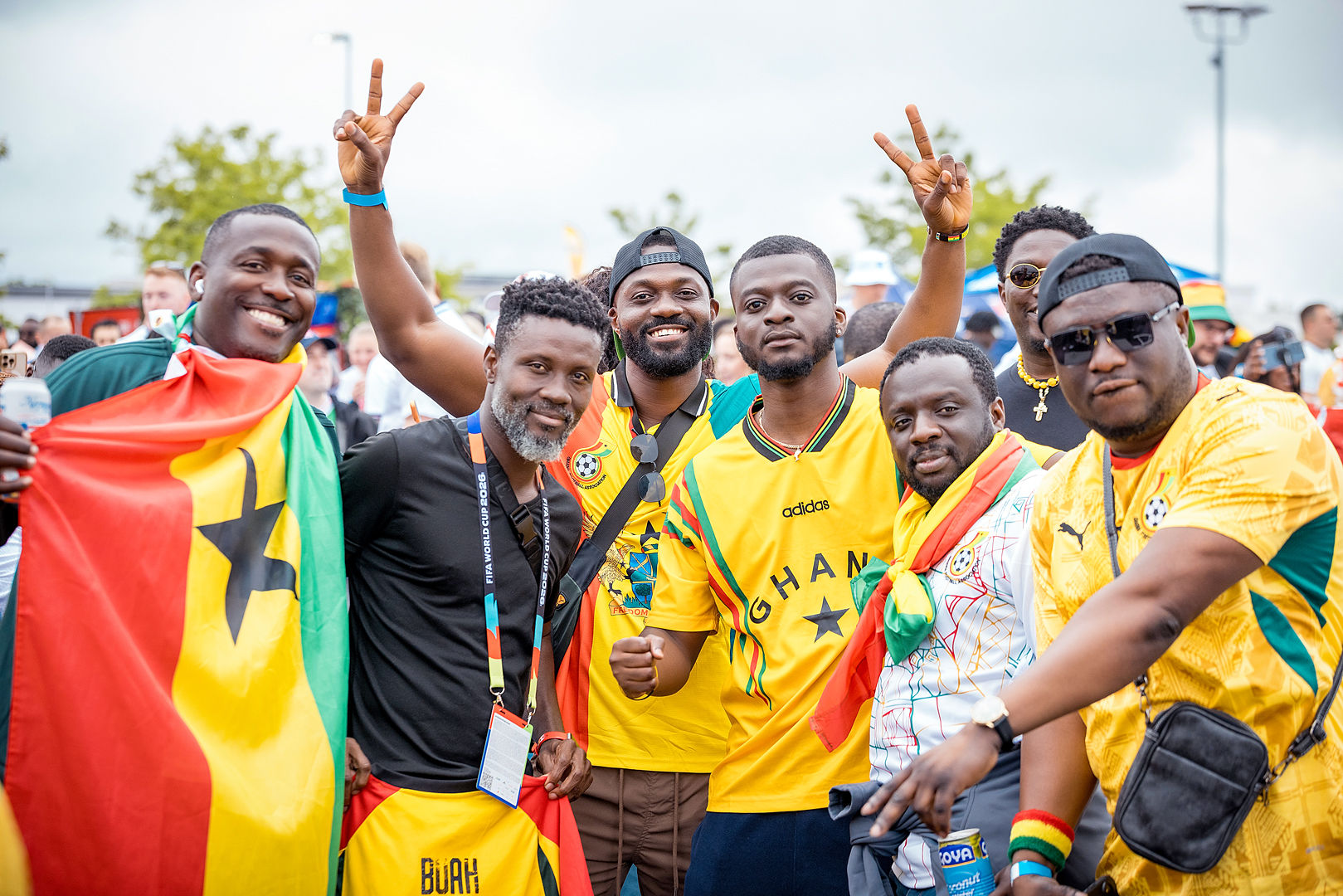 Ghana fans with FIFA World Cup lanyards celebrating together