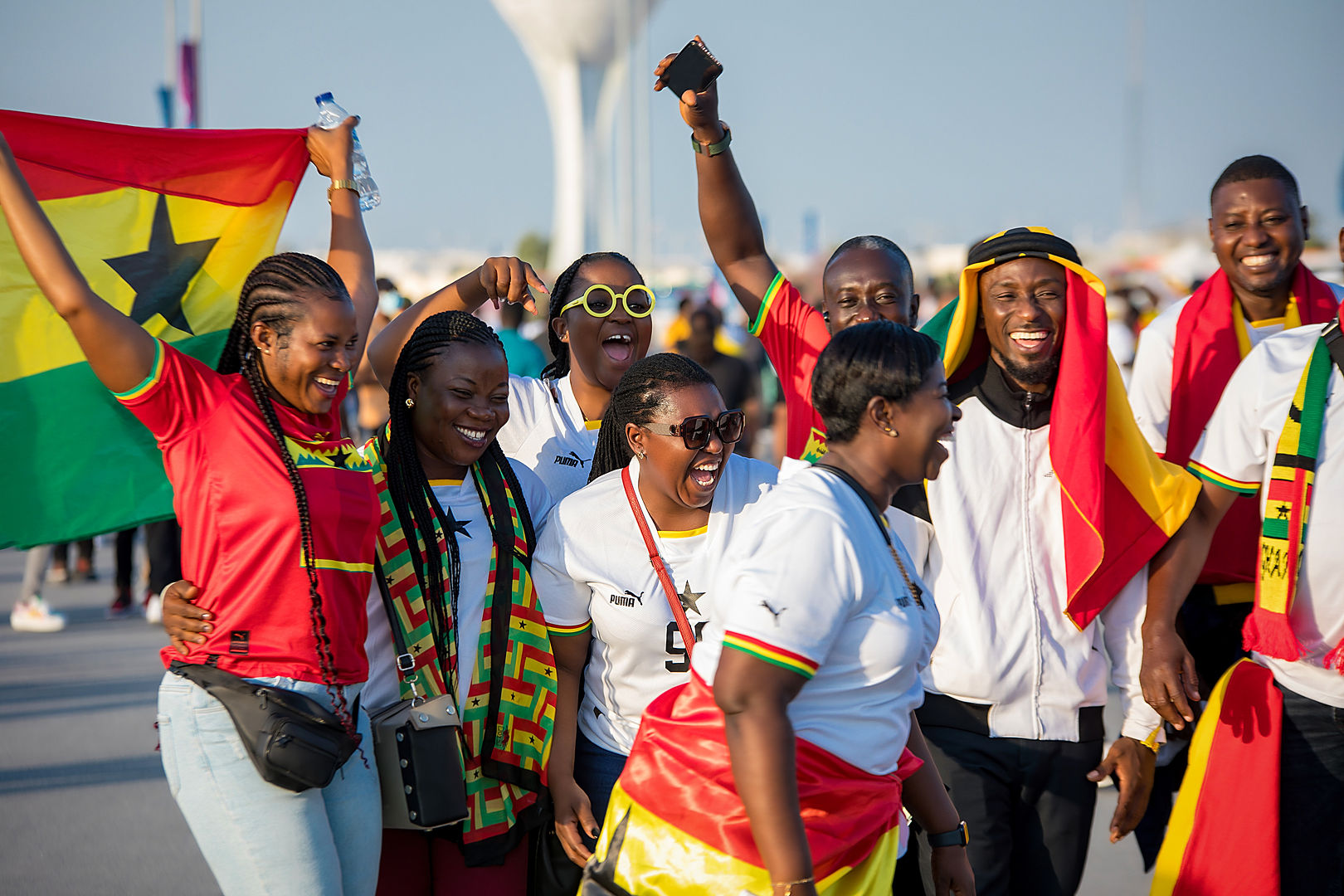 Ghana fans celebrating with flags